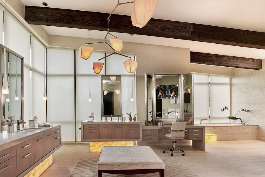 large bathroom with vanity and floor-to-ceiling automated roller shades installed in the windows