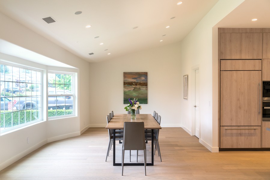 A dining room featuring Ketra LED lights on the ceiling.