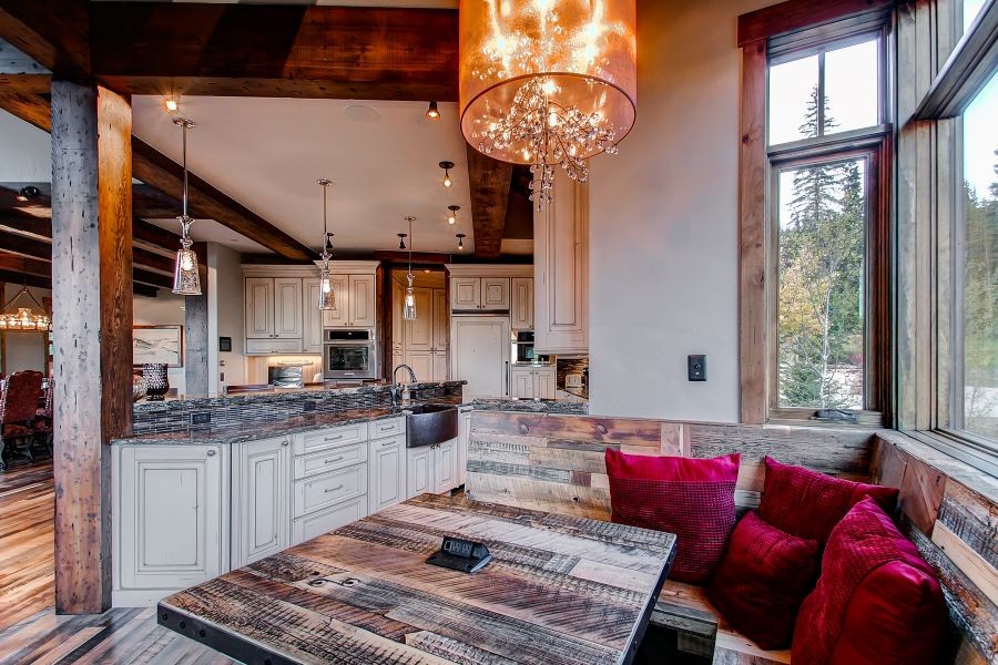 A beautifully illuminated kitchen and dining area.